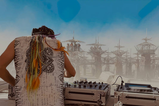 Treavor Moontribe wearing Psylo Jaya Sleeveless Tee while playing at Burning Man 202 Church Artcar Sunset Cruise
