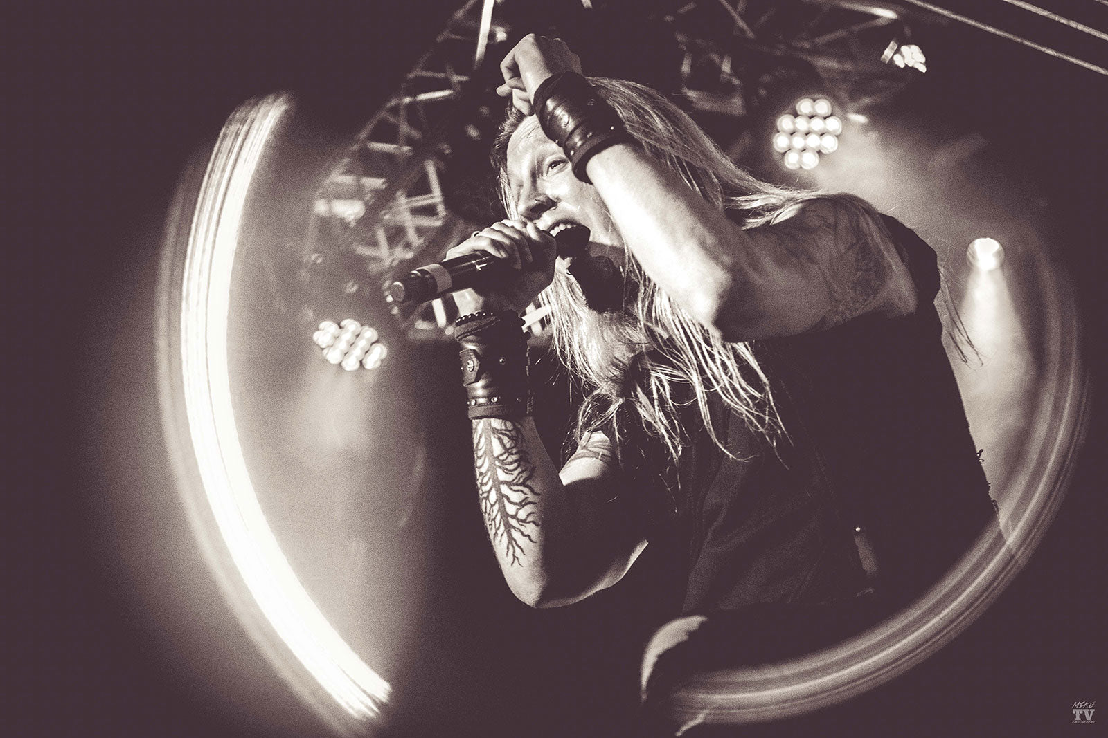 Marc Hudson lead singer of Dragonforce wearing Psylo fashion streetwear on stage