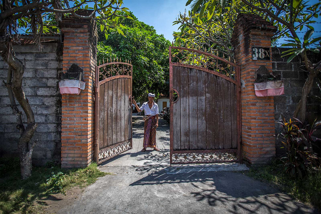 Guard standing at gate Psylo's HQ entrance, Bali