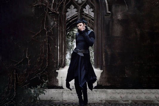 Woman wearing Goth style outfit on a gothic architecture backdrop