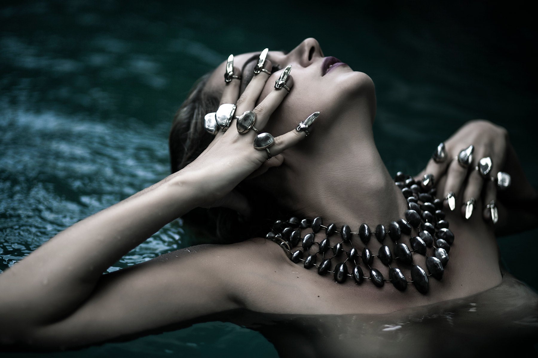 model wearing statement rings and necklace jewellery at Psylo fashion 