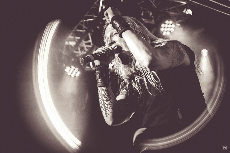 Marc Hudson lead singer of Dragonforce wearing Psylo fashion streetwear on stage