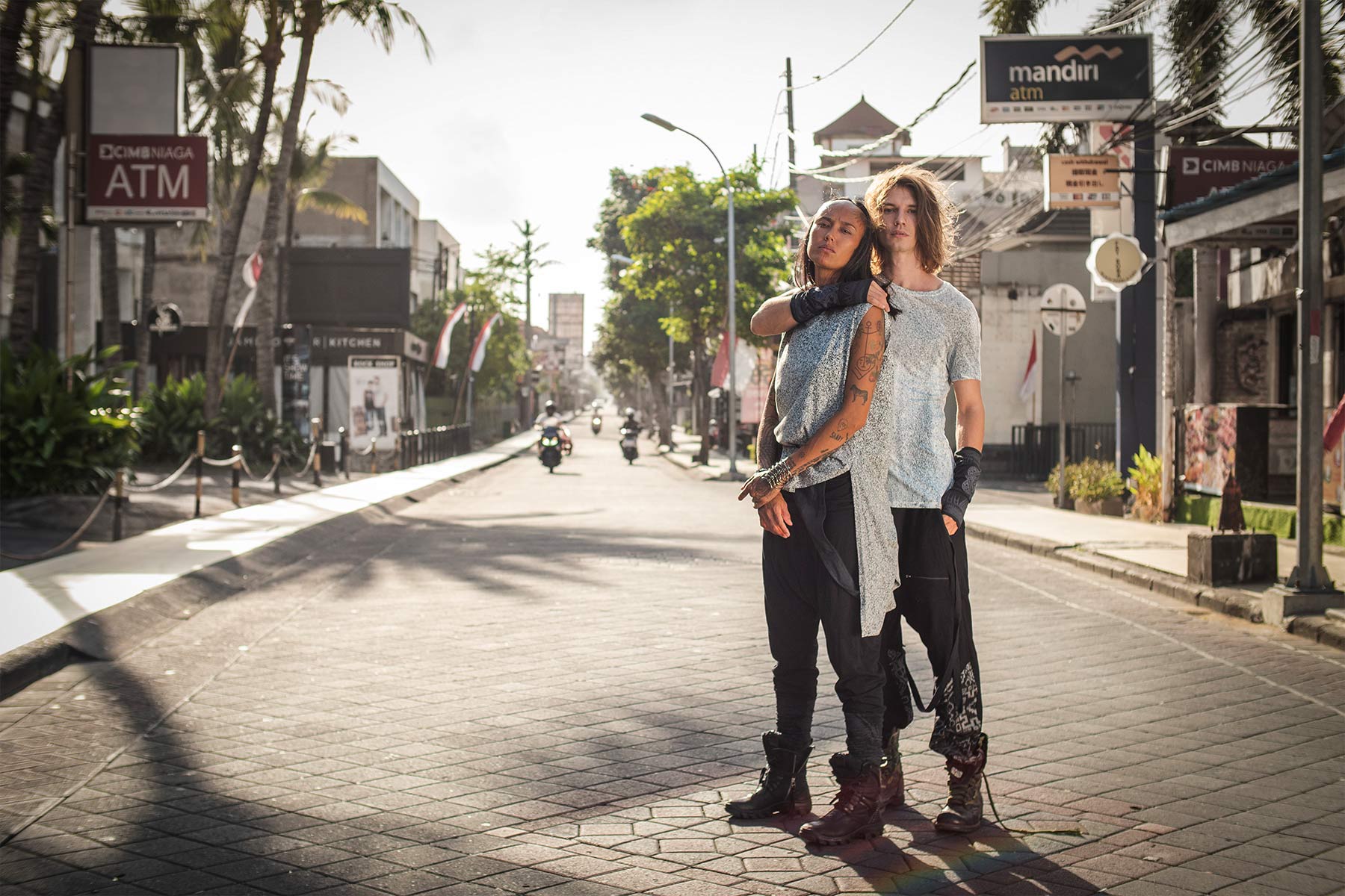 couple wearing Psylo fashion unisex clothing in Kuta's street, Bali